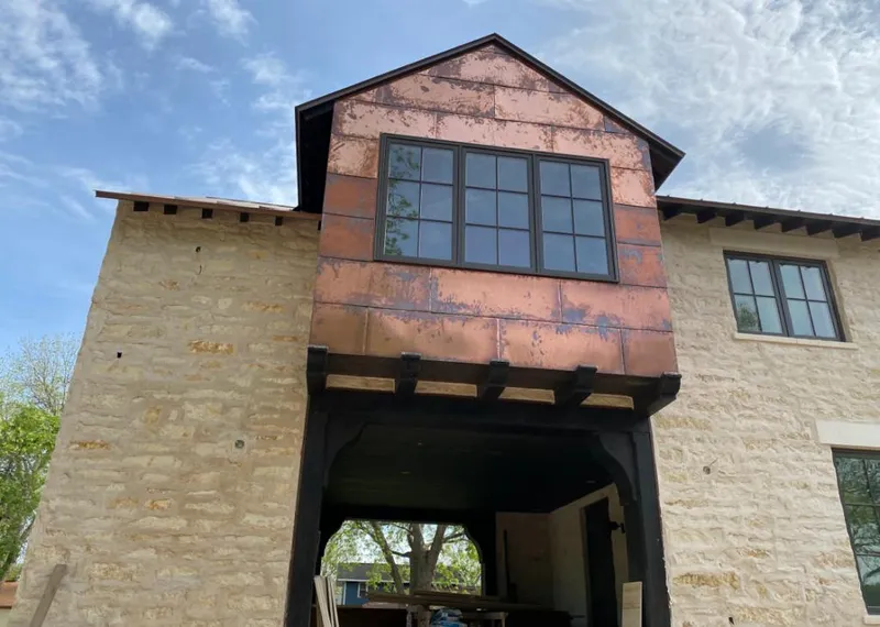 Copper metal panel facade on a stone building for Metal Roof Coating in Tracyton